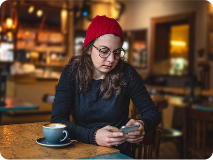 girl on mobile phone in hat