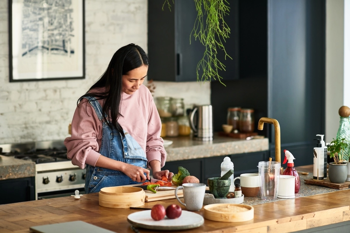 woman prepping a healthy meal in her kitchen